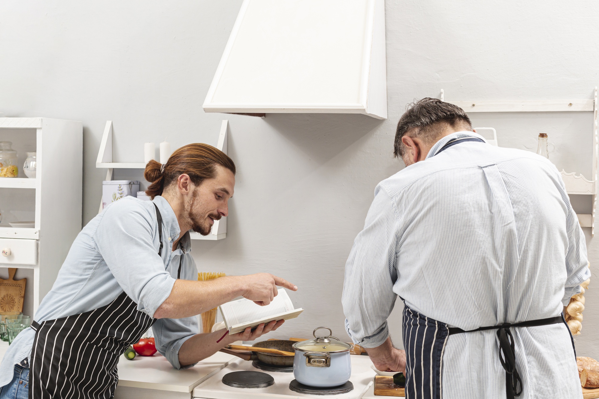 Chef instructing over stove