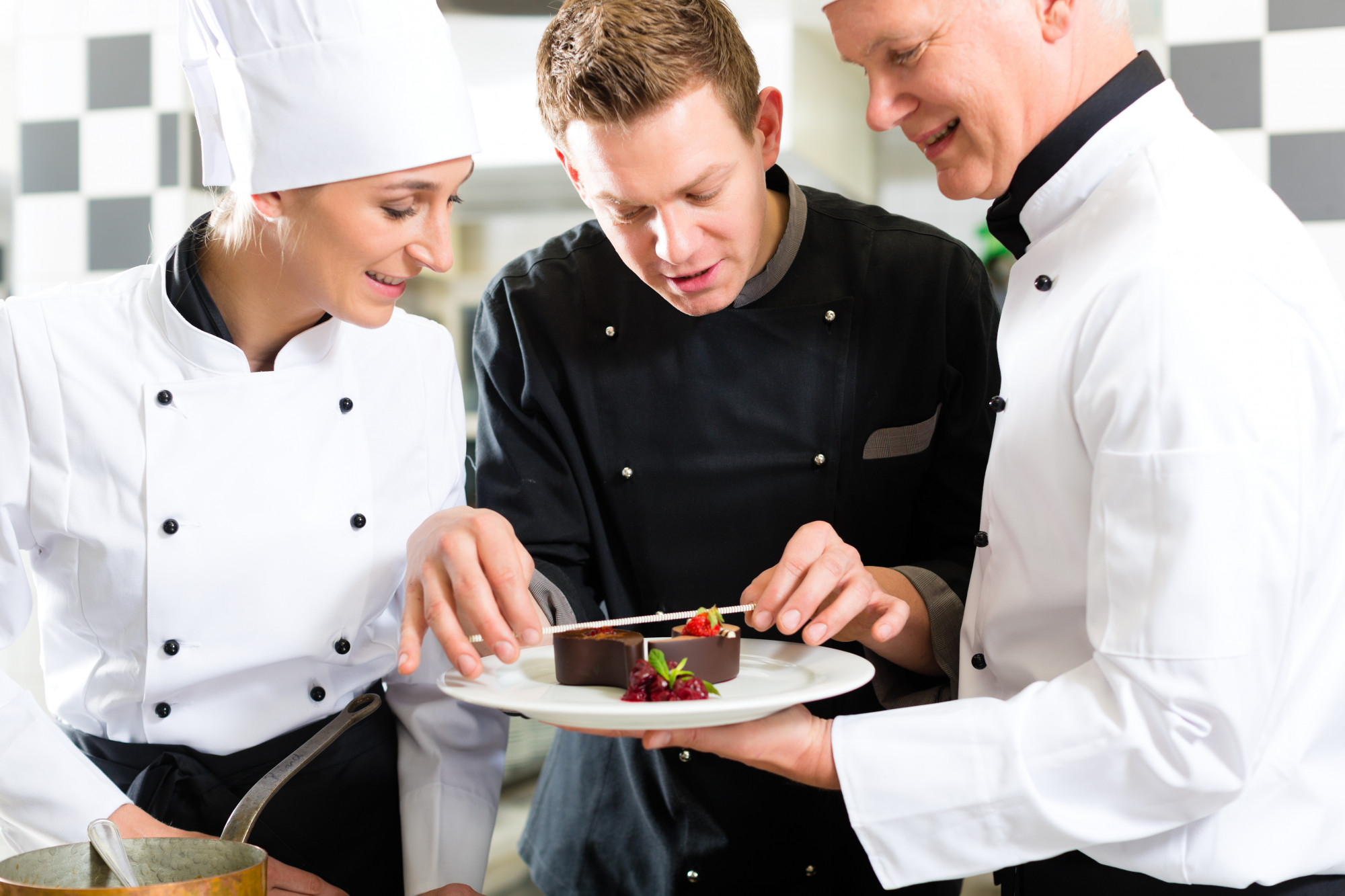 Chef demonstrating plating to students